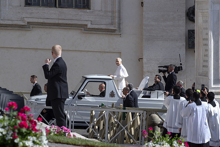 Pope Leo XIV arrives in popemobile during the Holy Mass for Pope Leo XIV inauguration at St. Peter's Square.