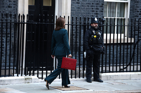 Chancellor of the Exchequer, Rachel Reeves, poses with the red Budget Box as she leaves 11 Downing Street to present the government's annual budget to Parliament.