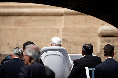 Pope Leo XIV greets the faithful as he leaves the square after the traditional Wednesday General Audience in St. Peter's Square in Vatican City, Vatican, on May 28, 2025.
