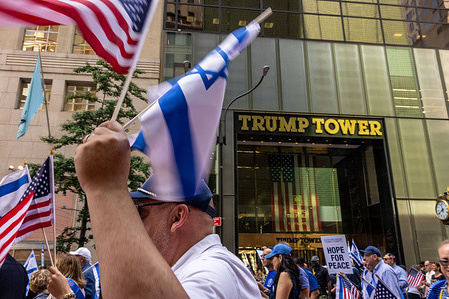 Participants walk past the Trump towers during the Israeli Day Parade. Spectators lined and cheered on parade, participants as they marched passed double barricades on 5th Avenue with heavy police presence and expansive secure zone.