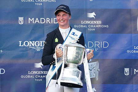 Sanne Thijssen poses with a trophy during the Longines Global Champions Tour Madrid Grand Prix trophy at the CSI 5 Global Champions Tour of Madrid 2022 championship in Madrid. Dutch rider Sanne Thijssen won the Longines Global Champions Tour Madrid Grand Prix trophy.