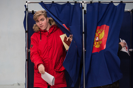 A man walks out of a voting booth during the 2018 Russian presidential election at a polling station in St. Petersburg.
The Presidential election of Russia is taking place on 18th March 2018. Candidates has to win more than 50% of the votes in order to be elected as president. Current president Vladimir Putin is forecasted to win the election with absolute majority.