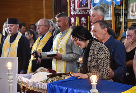 (EDITORS NOTE: Image depicts death)
A wife of a senior soldier Peter Sarakulo cries over his body in the church in the village of Kulchytsia, Lviv region. The funeral of senior soldier Petro Sarakulo is held in his native village of Kulchytsi, Lviv region. Due to the Russian military invasion of Ukraine on February 24, 2022, he went to serve in the Armed Forces of Ukraine. On May 5, in the Donetsk region, he died during a battle with the Russian occupiers. The deceased left his wife and two children - daughter Milana and son Alexander.