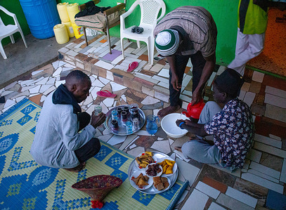Muslim men enjoy their special iftar meal after sunset during the Islamic fasting month of Ramadan in Kibera.
Regarding the ongoing Covid-19 containment measures in Nairobi to stop the fast spread of the Coronavirus, most Muslim brothers and sisters are today seen gathered in their homes with their families to enjoy their second day of celebrating their holy month of Ramadan with reasons of avoiding public and religious gatherings.