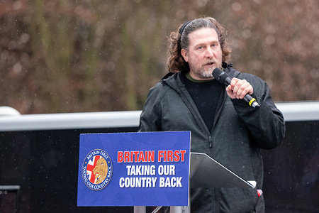 Speaker at Britain first rally Castlefield Bowl. Britain First a far right group marched through Manchester city centre. Anti facist groups formed counter protests along the route with some individuals having to be removed from sitting in the road. Police struggled to keep the opposing groups apart. Paul Golding the leader of Britain First made a speech at the Castle field bowl and intoduced far right speakers and acts including right wing singer 'John Bull'.Britain First demanded remigration of immigrants. Britain First supporters carried Union Jack flags and shouted abuse at the counter protesters who included members from Stand Up to Racism. Manchester UK Picture: garyrobertsphotography