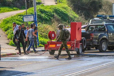 Israeli soldiers inspect the scene of the shooting of the Palestinian Aref Lahlouh (20 years old), who was shot dead by the Israeli army in front of his mother and brother near the entrance to the Israeli settlement of Kedumim, west of Nablus, in the West Bank. The Israeli army killed a Palestinian who tried to stab Israeli soldiers at a military point.