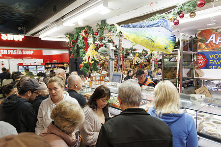 Shoppers line up at Aptus Seafood in the South Melbourne Market.