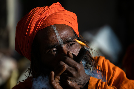 A Hindu holy man, or sadhu, smokes marijuana at the Pashupatinath Temple during the Mahshivaratri festival in Kathmandu.
Hindu Devotees from Nepal and India come to this temple to take part in the Shivaratri festival which is one of the biggest Hindu festivals dedicated to Lord Shiva and celebrated by devotees all over the world.