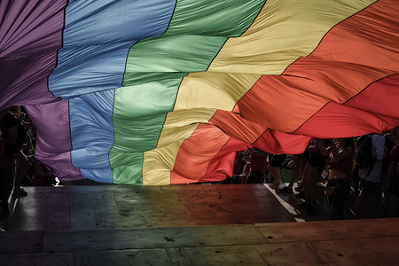 A big pride flag with rainbow colors seen at the festival.
This year's Pride theme was discrimination against women, with transnational women receiving lasting and unstoppable marginalization and violence.