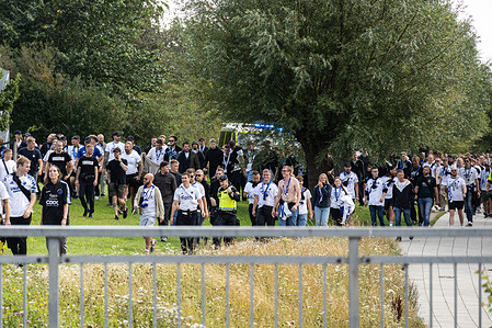 F.C. Copenhagen supporters march to the stadium before the UEFA Champions League 2025/26 third qualifying Round first leg match between Malmö FF and F.C. Copenhagen at Eleda Stadium.