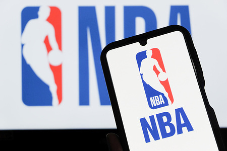 In this photo illustration, the NBA logo is displayed on a smartphone.
