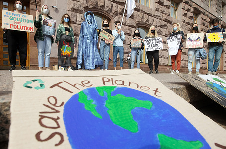 Protesters hold placards expressing their opinion during the demonstration outside City Hall in Kiev.
Climate activists all over the globe united for the first global climate strike action of 2020 held worldwide amid the COVID-19 coronavirus pandemic. The Global Day of Climate Action is a part of student protest, the Fridays for Future movement aiming to spark the world leaders into action on climate change.