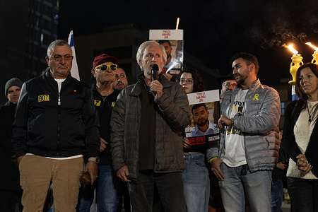 Former hostage Keith Siegel with families of released hostages at Hostages Square seen during the final Hanukkah candle-lighting ceremony. The eighth and final Hanukkah candle was lit at Hostages Square in a ceremony calling for the return of the last fallen hostage, Ran Goyali, still held by Hamas. The event was attended by his family and by the families of former hostages who have returned to Israel.