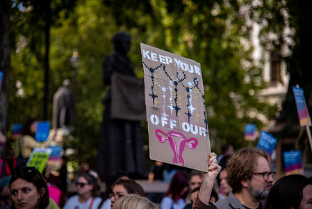 A protestor holds a placard during the Stand Up for Choice demo at Parliament Square. Abortion Rights has announced Stand Up for Choice 2026, its annual counter-protest to March for Life UK taking place at Parliament Square.