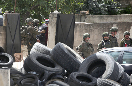 Israeli soldiers detain Palestinians in Anabta, east of Tulkarm in the northern West Bank, during a raid targeting several homes in search of wanted Palestinians accused by Israel of throwing stones and firing on Israeli patrols and military checkpoints.