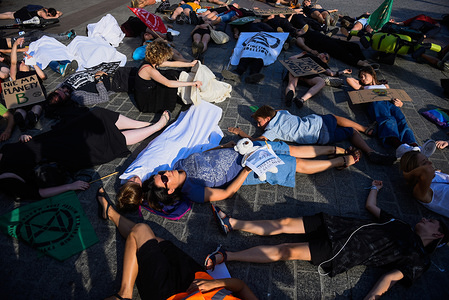 Protesters lay on the ground pretending to be dead (Die in action) performance at the Extinction Rebellion branch, Main Square during the demonstration.
The symbolic activist action highlights the problem of mass extinction and show the dangers of human activities connected with the climate crisis or climate change, a current worldwide situation.