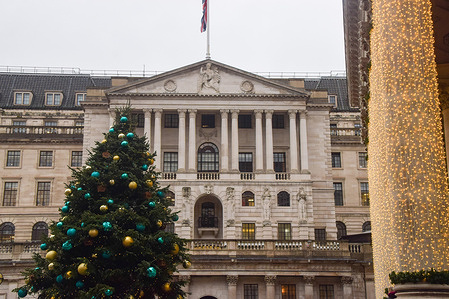 General view of the Bank of England and a Christmas tree ahead of an expected interest rate cut decision.