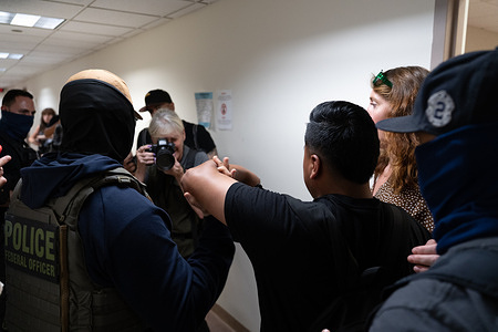 A man is is arrested by federal agents at the Executive Office of Immigration Review (EOIR) courts at 26 Federal Plaza.