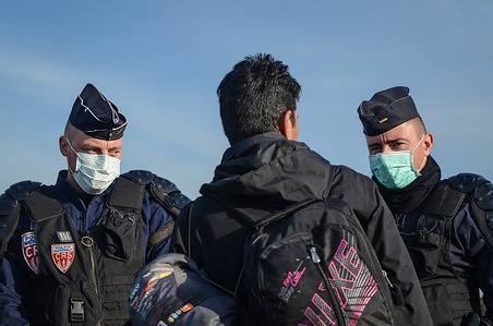 Two French police officers have an argument with a young Afghan refugee. The young man wanted to return to his tent in the Jungle and the police officers refused to allow him access into the smouldering ruins of the Jungle.


The Jungle was an illegal migrant camp in the northern French town of Calais. The camp attracted migrants and refugees from across the Middle East, North Africa and Sub-Saharan Africa who planned to illegally enter the UK. Eventually the French authorities were forced to close the Jungle because it had grown out of control and was becoming both a public health risk and a hub of criminal activity. 

The Calais Jungle was closed in October 2016.