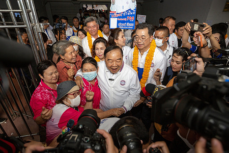 Thailand's Deputy Prime Minister and Prime Minister candidate of the Palang Pracharath Party, Prawit Wongsuwan (C), in the upcoming general election, greets his supporters during a pre-election campaign in Chiang Mai.