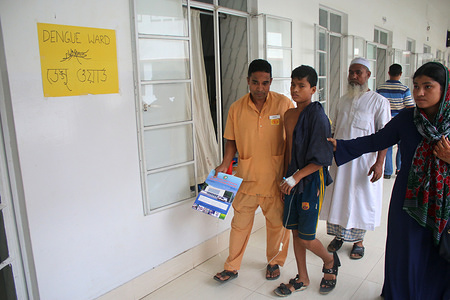 A Hospital ward boy helps a new dengue patient to move at the Dengue ward at Holy Family Medical College and Hospital in Dhaka.
Bangladesh records nearly 60,000 patients hospitalised for dengue so far in 2019. According to the Directorate General of Health Services or DGHS, a total of 59,592 dengue patients have been admitted to the different hospitals across Bangladesh from the beginning of the year.