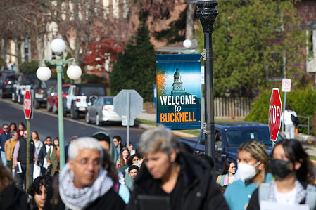 Pro-protesters march on the campus of Bucknell University during the "Shut it Down for Palestine" demonstration. The demonstrators called for an immediate ceasefire in Gaza, cutting aid to Israel, and lifting the siege on Gaza.