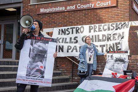 A woman activist speaks into a megaphone during a demonstration outside the Margate Magistrates and County Court. Pro-Palestine protesters gathered outside the Margate Magistrates' Court because eight members of the Palestine Action are on trial. The reason is the actionists recently shut down every entrance of the Elbit Systems' Instro Precision weapons factory in Sandwich, Kent to stop the production of Israeli weapons used in deadly attacks on Palestinians.