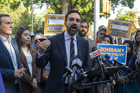 Democratic New York City mayoral candidate Zohran Mamdani launches a campaign's savings calculator website, reflecting his proposed three "Big Commitments:" a rent freeze on rent-stabilized apartments, universal child care, and fare-free buses and financed by his proposed "'millionaire tax:' an additional 2% tax on New Yorkers earning more than $1 million a year" at Travers Park in the Queens borough of New York City.