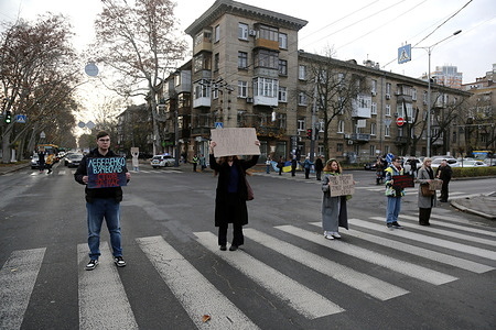 Activists hold placards expressing their opinion during a protest at Taras Shevchenko Avenue. A minute of silence is another ritual of respect for fallen soldiers, common in many cultures and religions. On March 16, 2022, Volodymyr Zelenskyy signed a decree establishing a nationwide minute of silence. Since then, Ukraine has commemorated the fallen every day at 9:00 a.m.