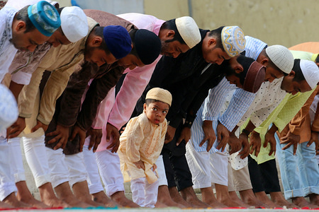 Muslims pray at National Mosque during the celebration in Dhaka.
Eid al-Adha is the biggest celebration for Muslims in all over the world after Eid al-Fitr to commemorate the willingness of Ibrahim (also known as Abraham) to follow Allah's (God's) command to sacrifice his son.