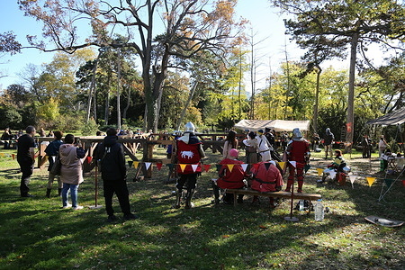 General view of the fighting field, spectators, and knight reenactors at the Odessa Botanical Garden of the I. I. Mechnikov National University. Medieval reenactors from the Tangar club held a charity knight's tournament at the Odessa Botanical Garden of the I. I. Mechnikov Odessa National University, whose greenhouses were damaged by a fire following a Russian drone strike in early September.