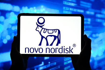 In this photo illustration, the Novo Nordisk logo is seen displayed on the screen of a smart tablet.