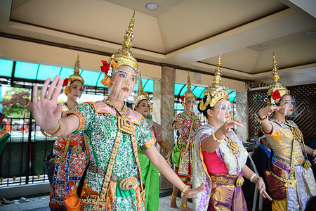 Traditional Dancers at the Erawan shrine, a popular tourist site perform while wearing face shields as a precaution following the government's easing of some coronavirus restrictions during lockdown.