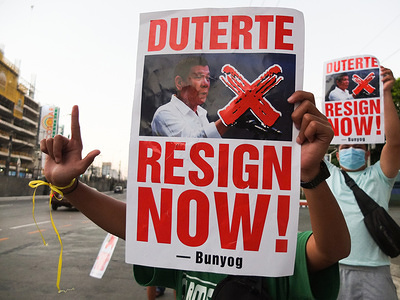 Protesters hold placards during the demonstration.
Members of various groups gathered at the People Power Monument in Quezon City to call for the ouster of Philippine President Rodrigo Duterte. They accused his government of being like a big syndicate and he looked like a butcher in his drug war campaign, He allegedly sold the country to China, and his termination of the visiting forces agreement with the United States.