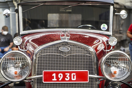 Detail of a Ford vehicle from 1930 during a vintage car show.