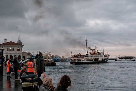 People are seen along the shore in Kadikoy.
