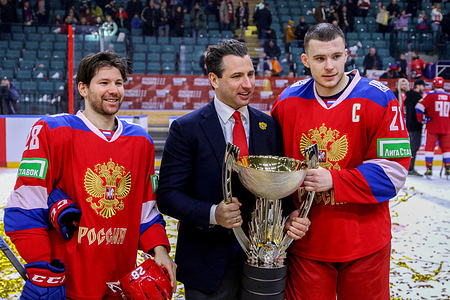 Russia 25 national hockey team player, Alexander Nikishin (21), Sergey Tolchinsky (28) and Roman Rotenberg, head coach of the Russia 25 national team and the SKA hockey club at the award ceremony after the hockey match during the Channel One Cup (ice hockey) between Russia 25 and Kazakhstan at the Ice Sports Palace. (Final score; Russia 25 5:2 Kazakhstan)