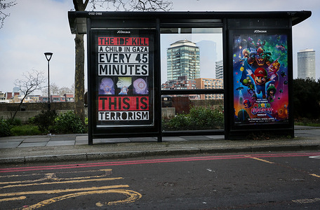 Activists have left a poster at a bus stop on a busy London street. Activists change a bus stop poster and leave one that reads ‘The IDF Kills A Child In Gaza Every 45 Minutes -This Is Terrorism’ opposite the U. S embassy in London.