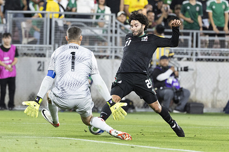 Australia goalkeeper Mathew Ryan (1) makes a save against Mexico’s Cesar Huerta (21) during a MexTour Sendoff Match at Rose Bowl in Pasadena, Calif. Final score; Mexico 1:0 Australia.