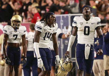 Akron Zips wide receiver Jasaiah Gathings (14) and Akron Zips quarterback DJ Irons (0) react during an NCAA college football game against Indiana University. IU won 29-27 in overtime.