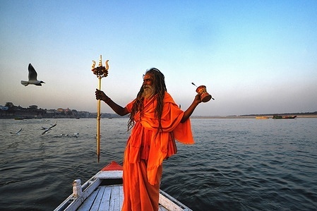 A Sadhu seen standing on boat on the Ganges.