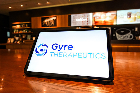 In this photo illustration, the Gyre Therapeutics logo is displayed on the screen of a tablet.