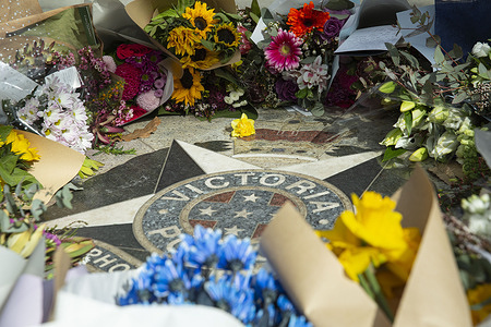 Flowers seen laid in tribute at the Police Memorial. A flower tribute is held at the Police Memorial to honour Detective Leading Senior Constable Neal Thompson and Senior Constable Vadim De Waart, who were shot dead while attempting to serve a search warrant at a property in Porepunkah. The tragedy has drawn widespread grief and tributes from colleagues, community members, and political leaders, underscoring the risks faced by police officers in the line of duty.