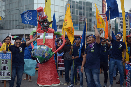 Protesters seen shouting slogans during the demonstration. Workers marched to convey their aspirations to the government and owners of different companies, to demand better working conditions and welfare for all during the May Day in Medan, North Sumatra.