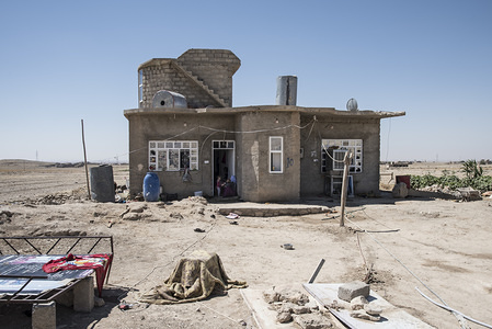 A house seen under reconstruction process. In the summer of 2014, Sinyar, the main Iraqi city of the Yazidi population, was attacked by Daesh, a siege that lasted more than 4 months. The Yazidis who managed to return to their homes found a ruined city full of improvised explosive devices. 
In August 2014, the Islamic State captured Sinjar, the main city of the Yazidi population in Iraq. Now, with the city in ruins, United Nations of Iraq and UN-Habitat have began an urban recovery program largely financed by the government of Germany. This program employs the people of the region to reconstruct the most damaged households.
