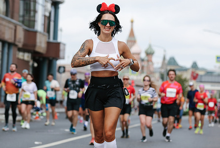 Amateur athletes running the 2025 Moscow Marathon. Set against a backdrop of lively sidewalk cafes and cheering spectators, over 42,000 athletes competed in the 2025 Moscow Marathon. The course wound through the city's historic center and scenic riverfronts. Dmitry Nedelin won the men’s race in just over 2 hours and 10 minutes, with Luiza Lega taking the women's crown in approximately 2 hours and 28 minutes.