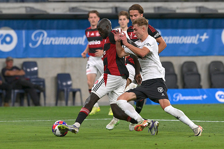 Ruon Kuk Tongyik (L) of Western Sydney Wanderers FC and Dean Bosnjak (R) of Macarthur Bulls FC seen in action during the 2025/26 Isuzu Ute A-League Men Round 11 match between Western Sydney Wanderers FC and Macarthur Bulls FC at Commbank Stadium. Final score, Western Sydney Wanderers FC 0 : 1 Macarthur Bulls FC.