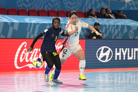 Fatuma Issa Suleimani (L) of Tanzania Women Futsal team and Yuka Iwasaki (R) of Japan Women Futsal team seen in action during the Group C match between Tanzania and Japan at the FIFA Futsal Women's World Cup 2025 held at PhilSports Arena. Final score; Tanzania 0: 9 Japan.