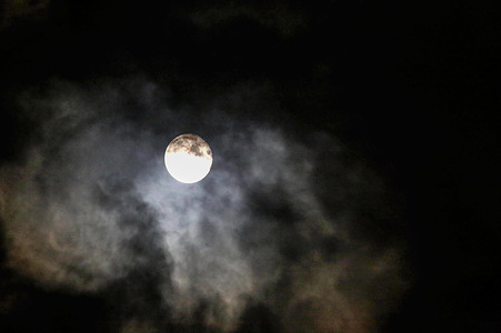 Smoke rises from the Iranian missile near the moon after its launch toward Israel over Nablus in the West Bank, part of a series of retaliatory strikes following US and Israeli attacks on the Islamic Republic of Iran.
