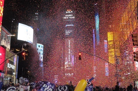 A crowd of revelers celebrate under falling confetti after the New Year's Eve ball drop marked the start of 2026. Crowds gathered in Times Square, Manhattan, New York City to observe the New Year's Eve ball drop ushering in 2026. The annual Times Square tradition draws revelers from around the world.